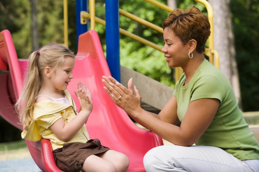 Therapist with Child on Slide